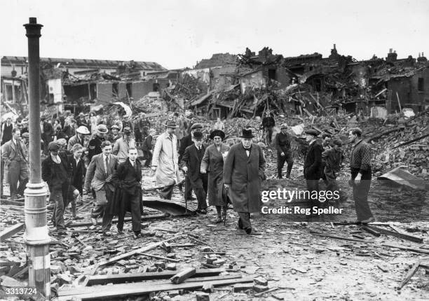 British Prime Minister Winston Churchill inspecting air raid damage in Battersea, south London, during the Blitz, 10th September 1940.