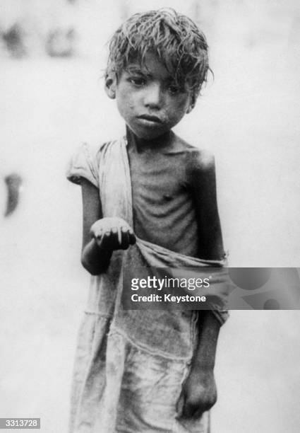 An Indian child begging for food on the streets of Calcutta.