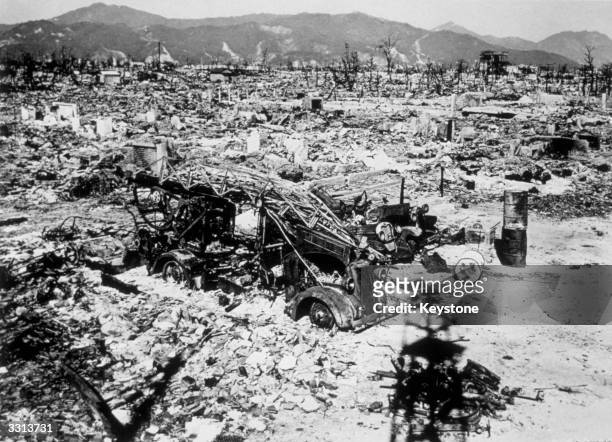 Atomic bomb damage at Hiroshima with a burnt out fire engine amidst the rubble.