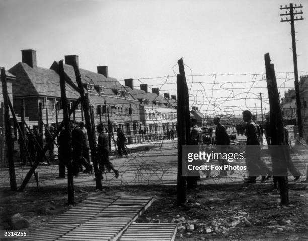 An internment camp for 'enemy aliens', Huyton housing estate, Liverpool, surrounded by a barbed wire fence.