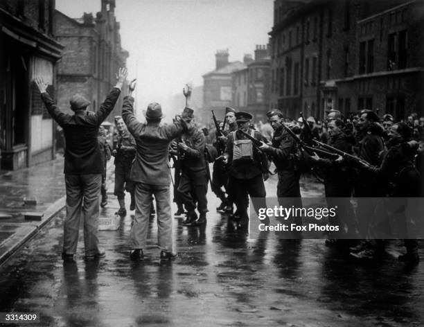 Guards rounding up 'looters' during an invasion exercise in Birkenhead.