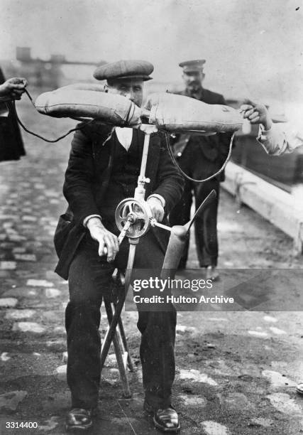 Man demonstrating the Marconelli life belt.