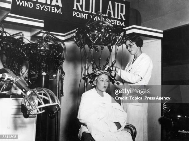 One of the devices for permanent waving, produced by Messers Gallia Ltd, on show at the Hair Dressing Exhibition, Olympia, London.