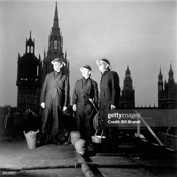 Fire guards on the roof of the Houses of Parliament, London. Original Publication: Picture Post - 1276 - Fire Guard On The House of Commons - pub....