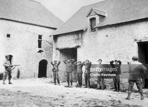 German snipers surrender, at a French farm which they were using as their headquarters.