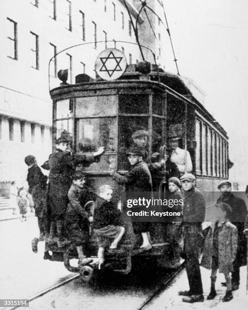 Jewish children on a tram in Warsaw's ghetto.