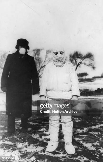 Doctor wears protective clothing during an outbreak of plague in Manchuria.