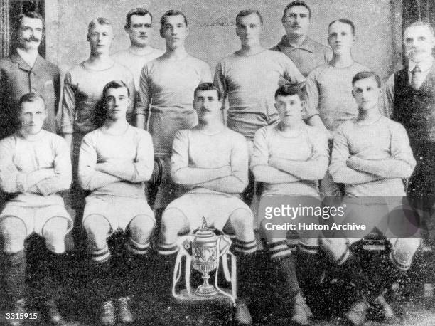The Manchester City team line up with the FA Cup trophy that they won with a 1-0 victory over Bolton Wanderers at Crystal Palace. From the back row,...