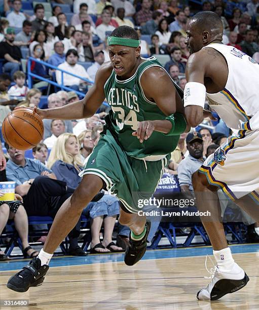 Paul Pierce of the Boston Celtics drives around Stacey Augmon of the New Orleans Hornets April 9, 2004 at the New Orleans Arena in New Orleans,...