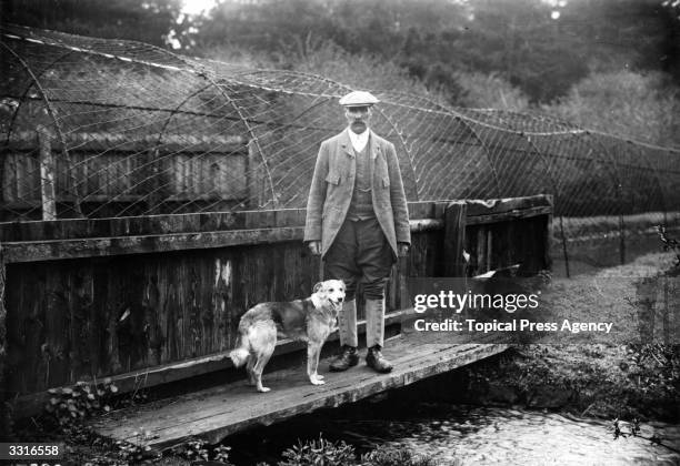 Mr Morley, the Duke of Leeds' head gamekeeper, with his dog.