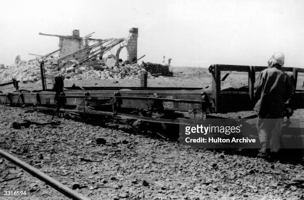British soldier, adventurer and author Thomas Edward Lawrence known as Lawrence Of Arabia, surveys the results of a train-wrecking mission. He joined...