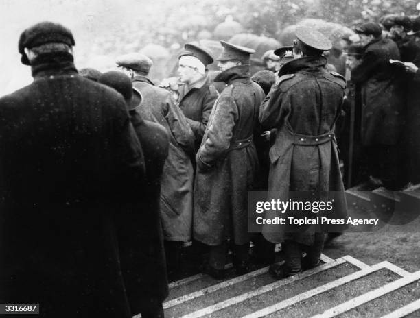 Wounded soldiers watch the FA Cup Final between Sheffield United and Chelsea at Old Trafford, Manchester.