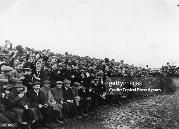 Section of the crowd cheering at the match between Swindon Town and Everton.