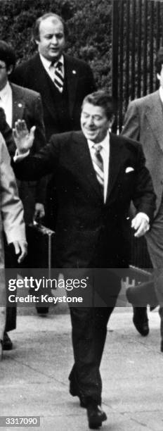 American President, Ronald Reagan, followed by his press secretary, Jim Brady who was shot in the head during an assassination attempt on Reagan.