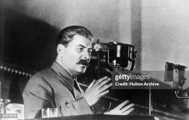 Soviet leader Joseph Stalin , addressing the Extraordinary 8th All Union Congress of Soviets on the draft of the USSR's constitution.