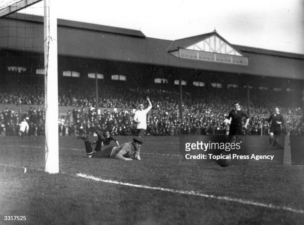 Fulham's goalkeeper pushes the ball from the goalmouth during their match against Bury at Craven Cottage.