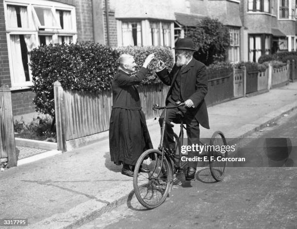 Mrs J Fraser waves goodbye to her husband as he sets off for a ride on his tricycle from their home in New Malden, Surrey, on their diamond wedding...