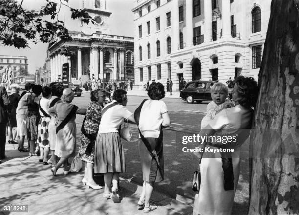 Demonstrators opposite South Africa House in Trafalgar Square, London, wearing black sashes in protest against the life sentences imposed on...