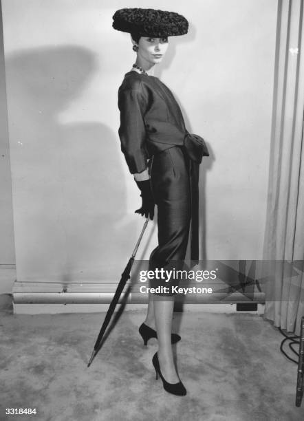 Avril Humphries modelling 'cocktail', a Persian blue silk and wool dress with caraco effect, tying in a large bow at the front, at the London showing...