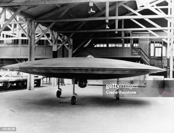 Scale model of a proposed VTOL 'flying saucer' aircraft, the Couzinet Aerodyne RC-360, on display at a workshop on the Ile de la Jatte in...