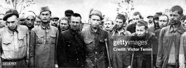 Group of Soviet prisoners at the Maidanek death camp, Germany, during the Second World War. Although destined for extermination, they were liberated...