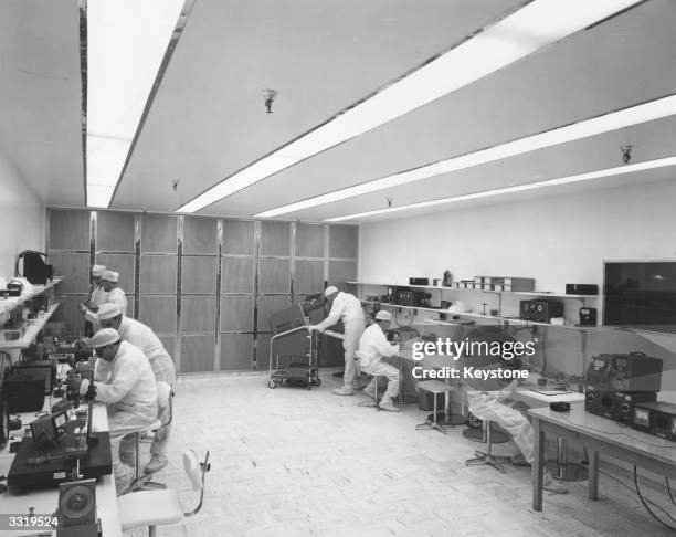 Technicians in surgical dress assembling sensitive parts for tactical missiles in an ultra clean room at General Dynamics/Pomona in Pomona,...