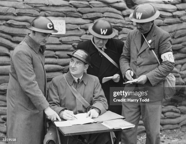 Councillor J A Da Palma, chief air raid warden for the borough of Fulham, London, at his post. He is to become the next Mayor of Fulham.