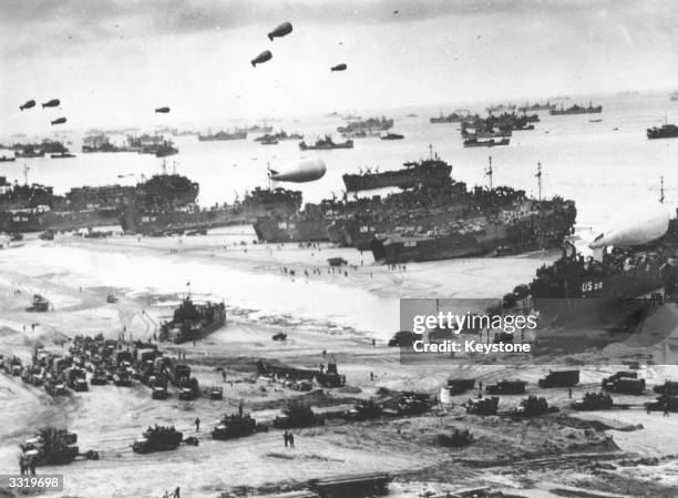 Fleets of US transport and landing craft disgorge reinforcements and supplies for the US troops who liberated the Contentin peninsula, the deep-water...