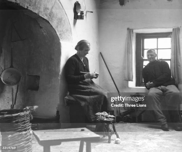 An Irish couple at home in their cottage on the Aran Islands in County Galway.