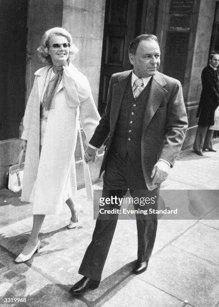 American singer and film actor Frank Sinatra with wife Barbara Marx in London.