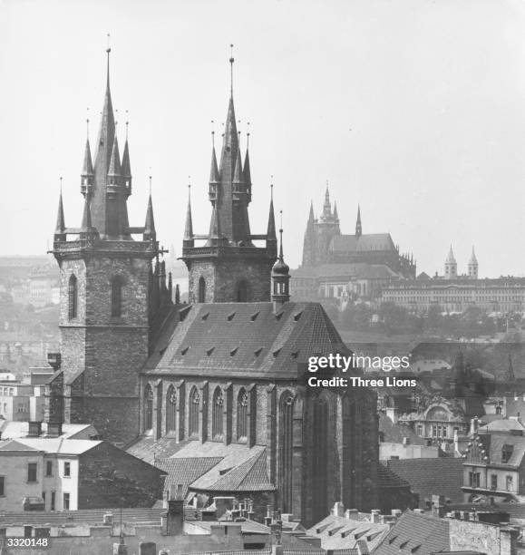 The 14th Century cathedral of Notre Dame de Tyn in Prague, Czechoslovakia,with the castle in the background.