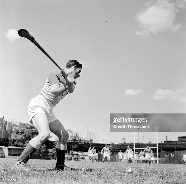 An Offaly player hitting the ball back into play from the sideline during a hurling match against Kilkenny at New York's Croke Park, the home of...
