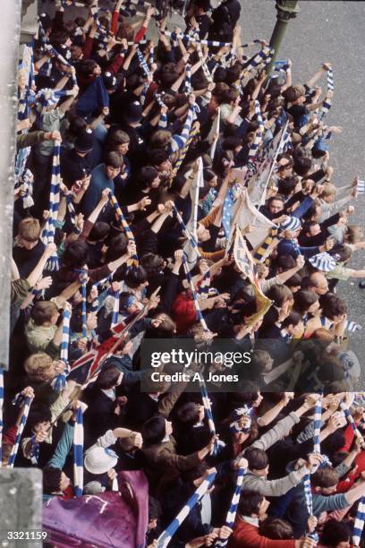 Supporters waving scarves and banners at Chelsea FC's victory parade to celebrate their winning the European Cup-Winners' Cup.