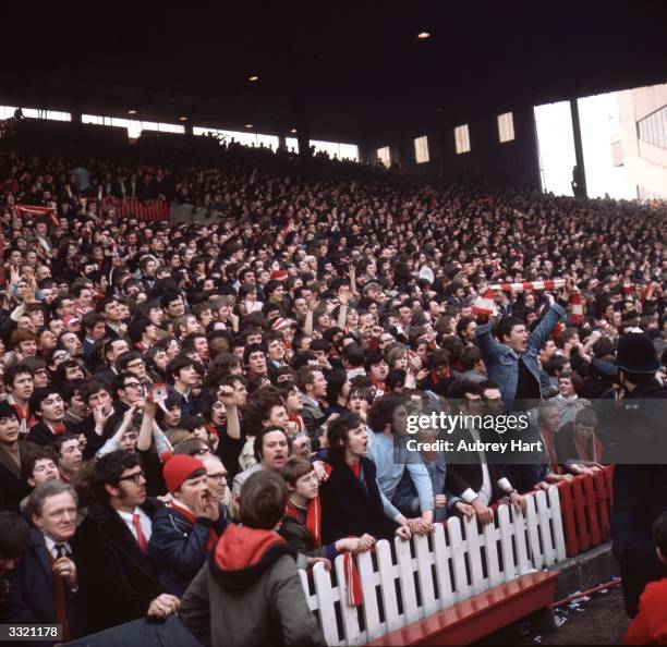 Supporters of Liverpool FC on the terraces during a semi-final match against Everton in the FA cup.