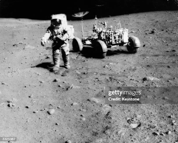 Apollo 15 astronaut James Irwin exploring the moon.