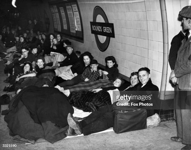 Londoners sheltering on a platform at Bounds Green tube station during an air raid in The Blitz.