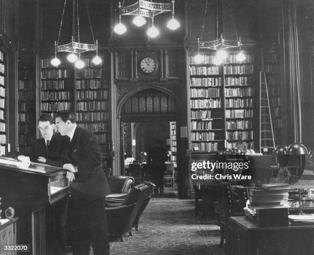 British Labour politician and newspaper proprietor Robert Maxwell being shown around the House of Commons library by Tam Dayell before the opening of...