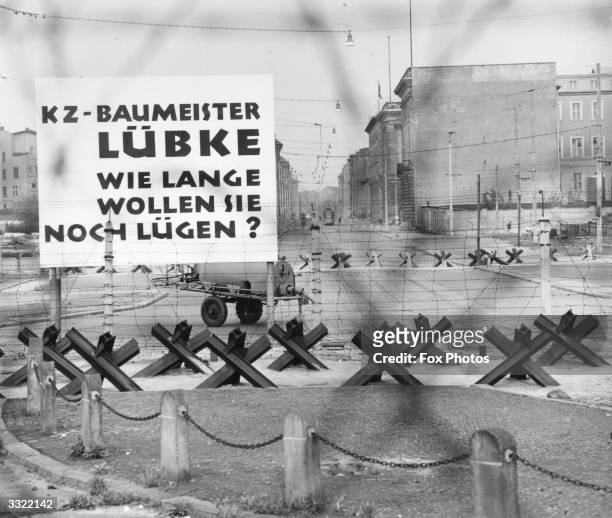 Large sign on the Berlin Wall near the Brandenburg Gate and Potsdamer Platz.