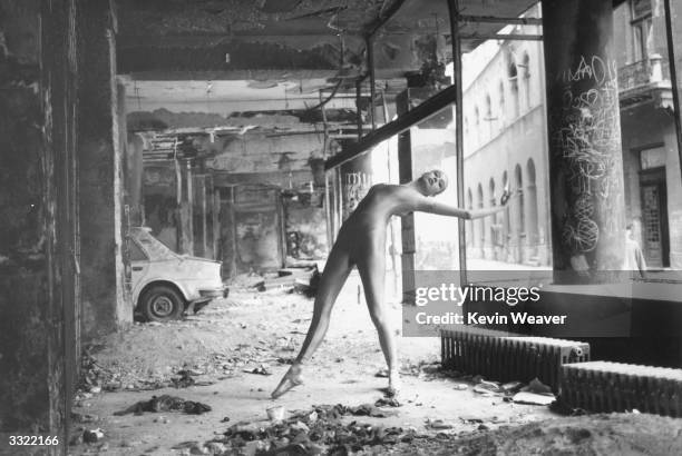 Eighteen year old ballet dancer Nina Brulic dancing in a devastated building at Sarajevo during civil war in Yugoslavia.