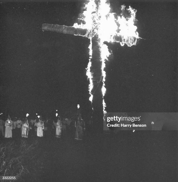 Burning cross dominates a meeting of the American white supremacist movement, the Ku Klux Klan in Beaufort, South Carolina.