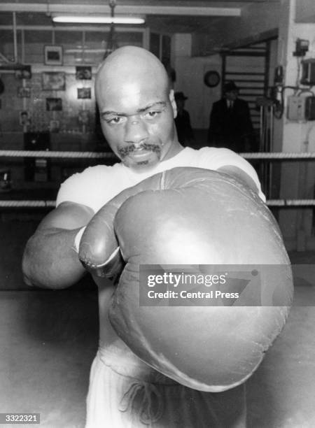 Boxer Rubin Carter trains in the ring.