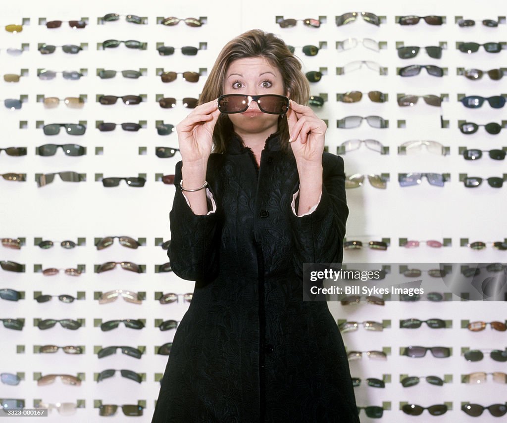 Woman Trying on Sunglasses