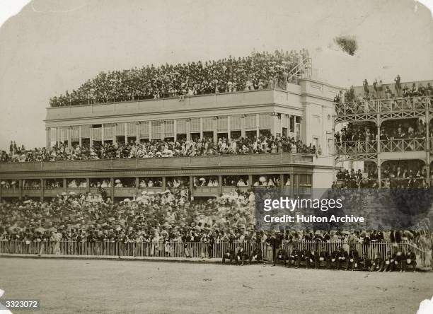 Crowd of racegoers on the grandstand at Ascot.