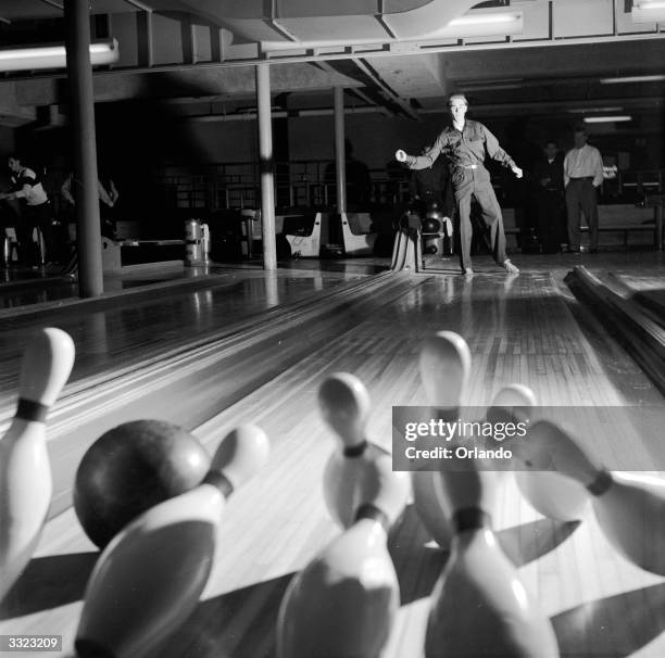 Tenpin bowler from Jamaica High School, New York, aiming for a strike.