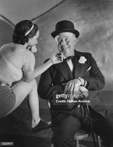 Guy Kibbee stars in a scene from the Warner Brothers musical 'Forty-Second Street' or '42nd Street'.