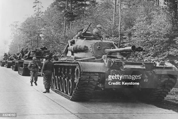 American tanks on alert in the Berlin Grunewald, West Germany, as the crisis over the Cuban blockade looms during the Cuban missile crisis.