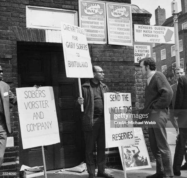 Peter Hain, leader of the campaign to stop the South African tour , talks to one of the demonstrators in the demo against against West Indian...