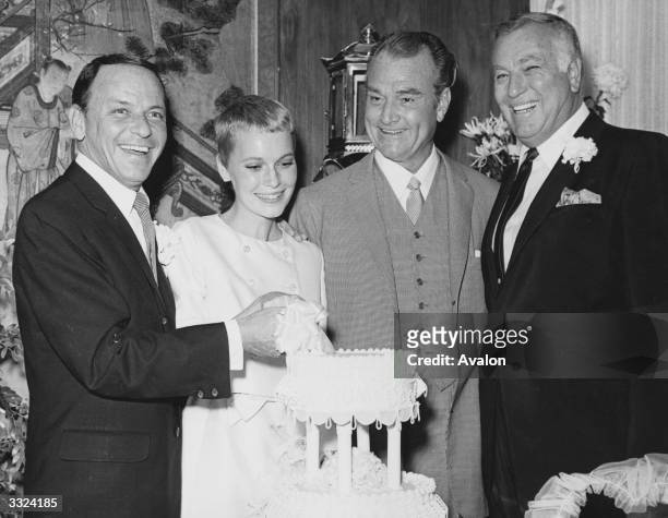 Actor and singer Frank Sinatra with actress Mia Farrow on their wedding day at Las Vegas with Red Skelton.