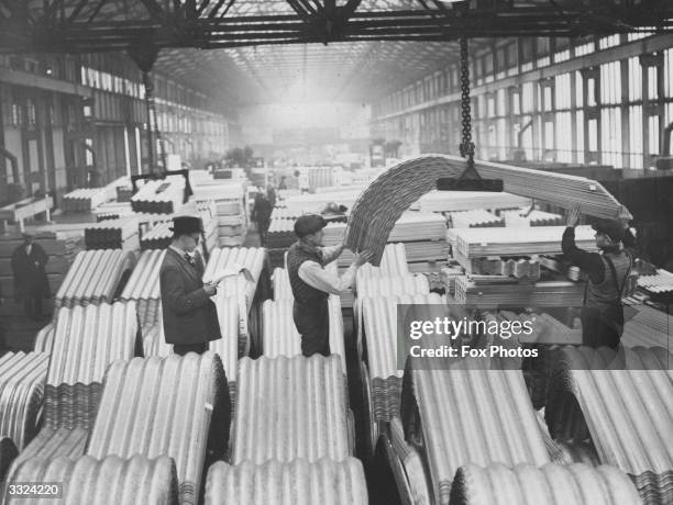 Air raid shelters under construction at the factory in Newport, Wales, before being transported to London. The shelters are to be supplied to every...