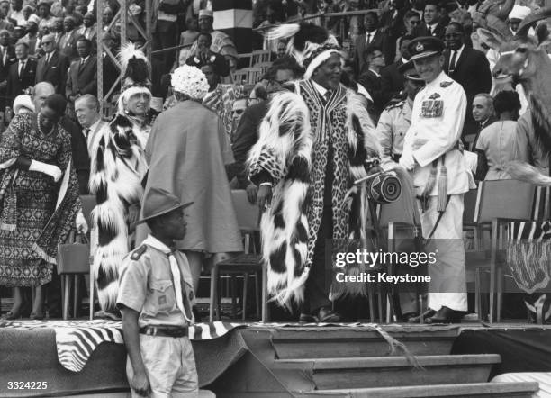 Kenya's first prime minister Jomo Kenyatta wearing colobus skins at the ceremony in Nairobi's Uhuru Stadium to proclaim Kenyan independence after 68...